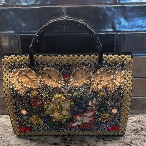 Embellished Vintage Handbag with Black Handles.